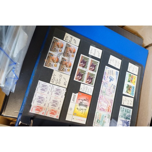 409 - A large collection of world first day covers together with a selection of stamps within albums to in... 