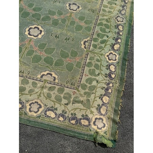 656 - Green ground rug, possibly a Donegal carpet, having intertwined foliage design to pond and border, 4... 