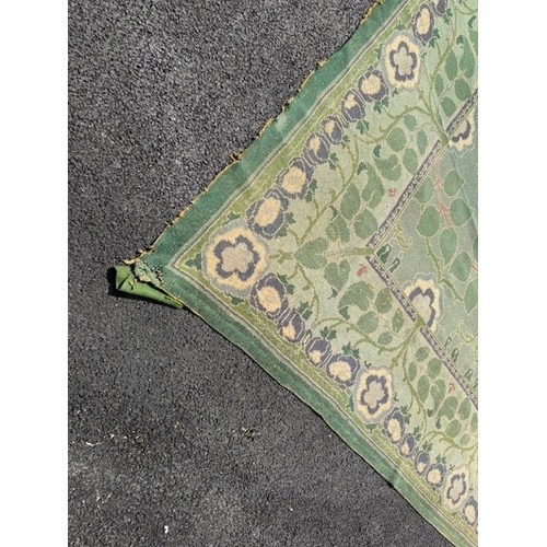 656 - Green ground rug, possibly a Donegal carpet, having intertwined foliage design to pond and border, 4... 