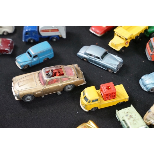 1397 - Around 65 mid 20th C play worn diecast models to include Corgi, Matchbox and Dinky featuring Corgi B... 