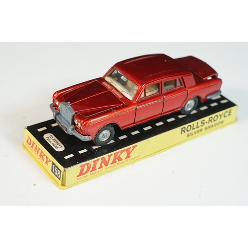 1414 - Three cased Dinky diecast models to include 158 Rolls Royce Silver Shadow in metallic red, 163 Volks... 
