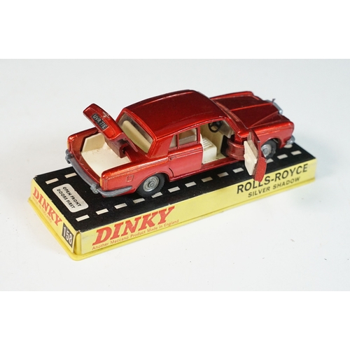1414 - Three cased Dinky diecast models to include 158 Rolls Royce Silver Shadow in metallic red, 163 Volks... 