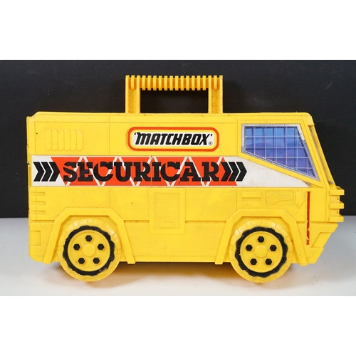 1424 - Matchbox Securicar carry case containing 14 x Matchbox Lesney 75 Series diecast models to include 10... 