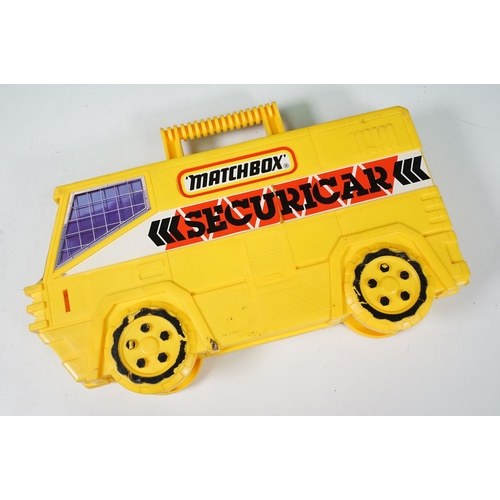 1424 - Matchbox Securicar carry case containing 14 x Matchbox Lesney 75 Series diecast models to include 10... 