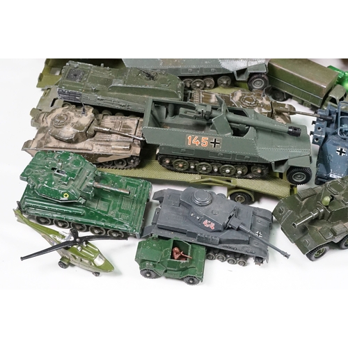 1440 - Over 75 Mid 20th C play worn diecast and metal military models to include2 x boxed Solido examples (... 