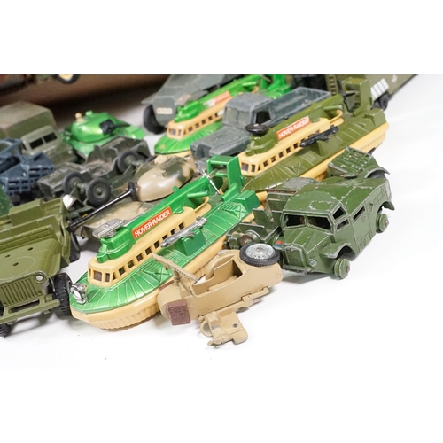 1440 - Over 75 Mid 20th C play worn diecast and metal military models to include2 x boxed Solido examples (... 