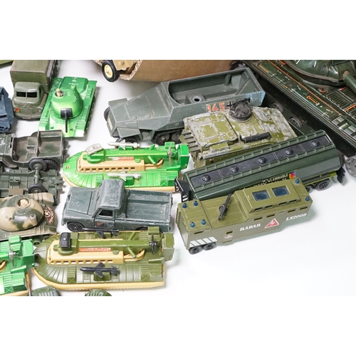 1440 - Over 75 Mid 20th C play worn diecast and metal military models to include2 x boxed Solido examples (... 