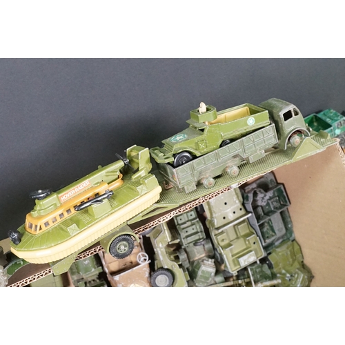 1440 - Over 75 Mid 20th C play worn diecast and metal military models to include2 x boxed Solido examples (... 