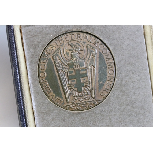 413 - A vintage Liverpool Cathedral commoners medallion within original case together with a small group o... 