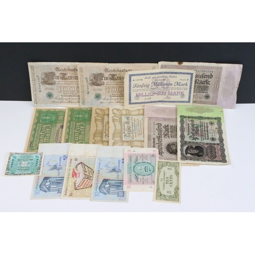 423 - A collection of early to mid 20th century German banknotes to include over inflation and emergency i... 