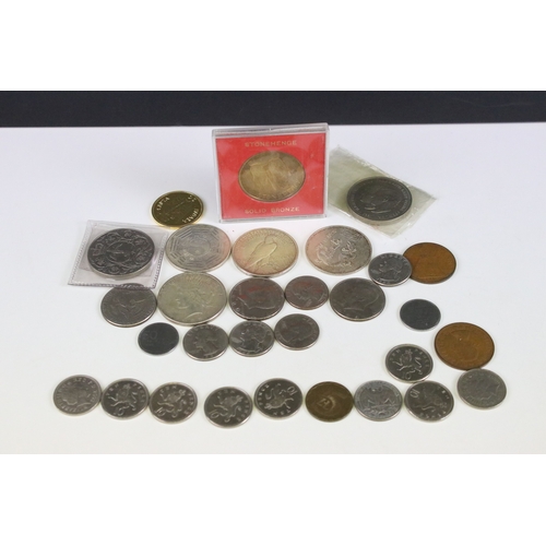 425 - A small collection of coins to include two United States of America silver peace dollars.