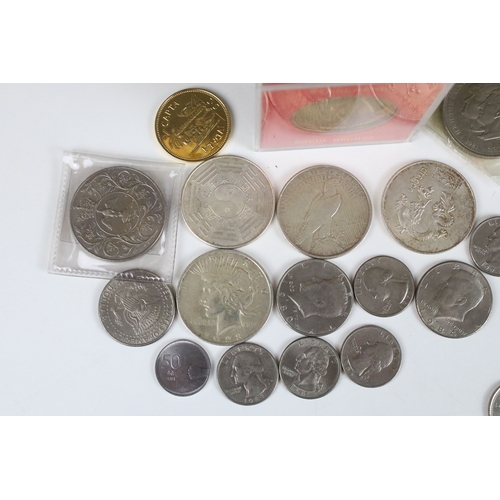 425 - A small collection of coins to include two United States of America silver peace dollars.