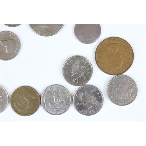 425 - A small collection of coins to include two United States of America silver peace dollars.