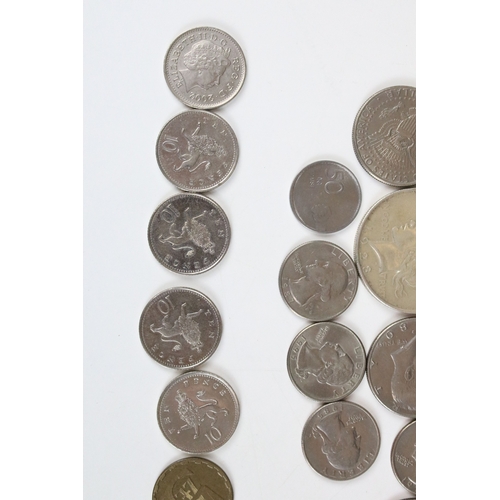 425 - A small collection of coins to include two United States of America silver peace dollars.