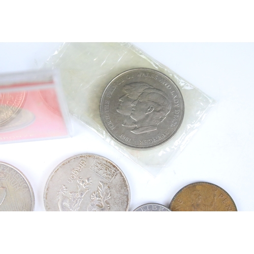 425 - A small collection of coins to include two United States of America silver peace dollars.