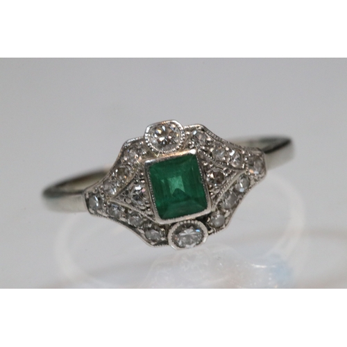 30 - Art Deco 18ct gold, emerald and diamond panel ring. The ring being set with a rectangular step cut e... 