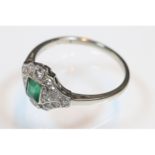 30 - Art Deco 18ct gold, emerald and diamond panel ring. The ring being set with a rectangular step cut e... 