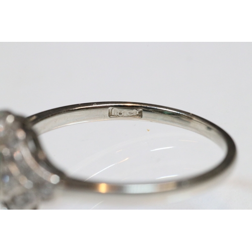 30 - Art Deco 18ct gold, emerald and diamond panel ring. The ring being set with a rectangular step cut e... 