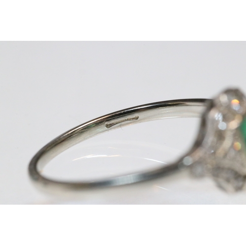 30 - Art Deco 18ct gold, emerald and diamond panel ring. The ring being set with a rectangular step cut e... 