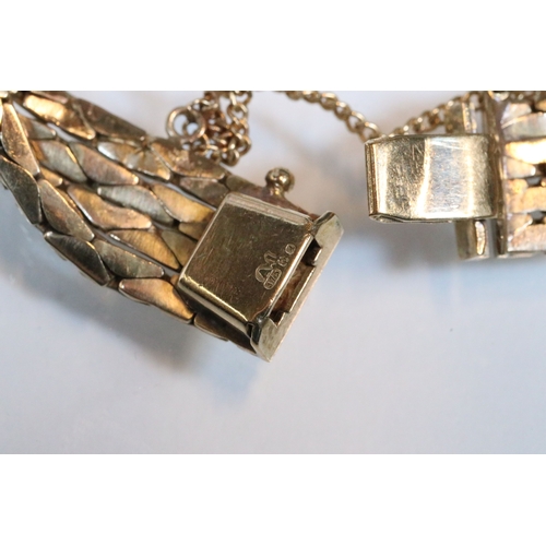 43 - 9ct gold four strand bracelet. The bracelet having a tongue in groove clasp with safety chain. Impor... 