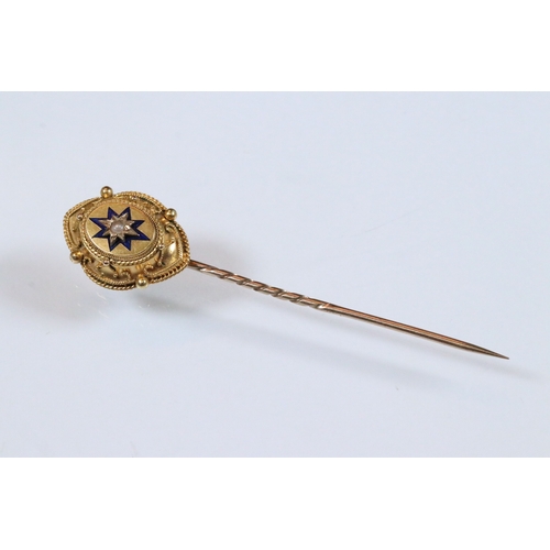185 - Group of three 19th Century stick pins to include a yellow metal example with pearl and enamel finia... 