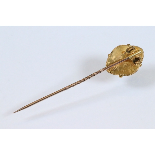 185 - Group of three 19th Century stick pins to include a yellow metal example with pearl and enamel finia... 