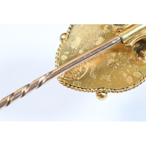 185 - Group of three 19th Century stick pins to include a yellow metal example with pearl and enamel finia... 