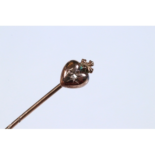 185 - Group of three 19th Century stick pins to include a yellow metal example with pearl and enamel finia... 