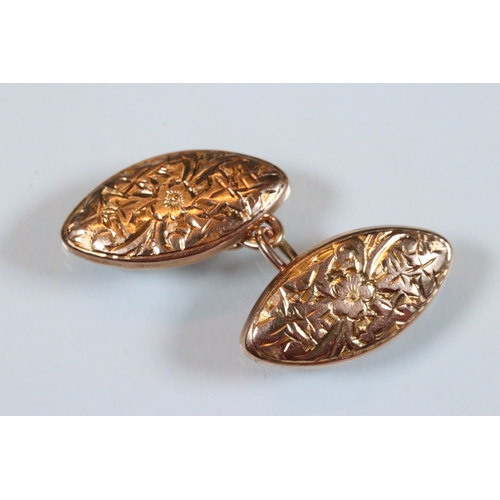 221 - Pair of 9ct gold cufflinks having engraved navette shaped heads united by chains (hallmarked Birming... 