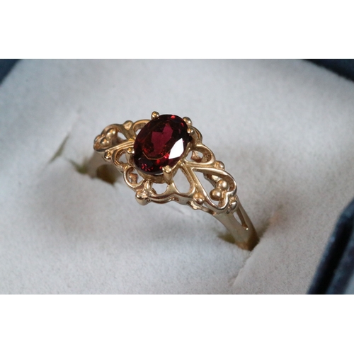 236 - 9ct gold and and pink tourmaline ring. The ring being set with an oval mixed cut tourmaline within a... 