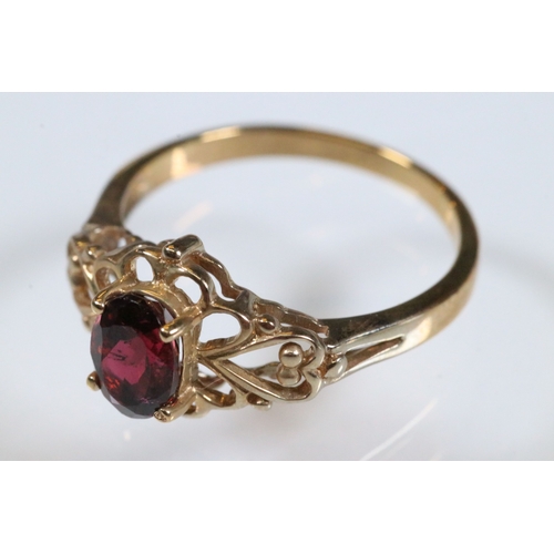 236 - 9ct gold and and pink tourmaline ring. The ring being set with an oval mixed cut tourmaline within a... 