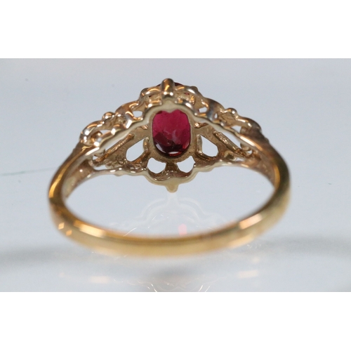 236 - 9ct gold and and pink tourmaline ring. The ring being set with an oval mixed cut tourmaline within a... 
