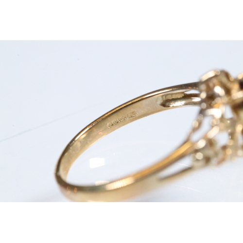 236 - 9ct gold and and pink tourmaline ring. The ring being set with an oval mixed cut tourmaline within a... 