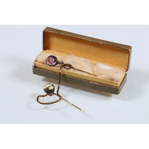 28 - Pair of 19th Century stick pins set with a round mixed cut amethyst and round mixed cut citrine unit... 
