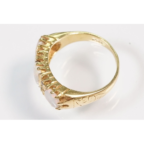 24 - 18ct gold, opal and diamond ring. The ring being set with three oval opal cabochons with six diamond... 