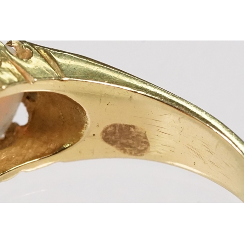 24 - 18ct gold, opal and diamond ring. The ring being set with three oval opal cabochons with six diamond... 