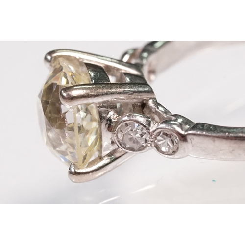 49 - Platinum and diamond ring. The ring being set with a round old cut diamond, flanked by four further ... 