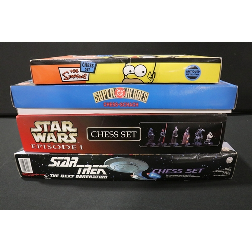 62 - Four boxed TV related chess sets to include DC Super Heroes, The Simpsons 'Antiqued metal style', St... 