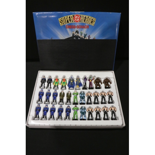 62 - Four boxed TV related chess sets to include DC Super Heroes, The Simpsons 'Antiqued metal style', St... 