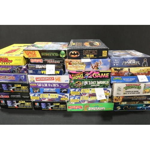63 - 28 Boxed TV / Film / Sci Fi related board games to include Mattel Harry Potter Whomping Willow, seal... 