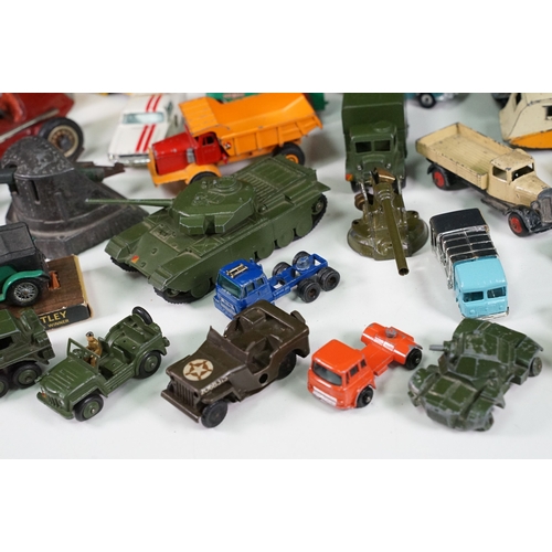 291 - Around 30 Mid 20th C onwards playworn diecast models to include Dinky, Corgi, Budgie Toys, Astra, Ma... 