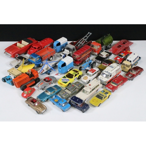 311 - Over 30 mid 20th C play worn diecast & plastic models to include Dinky, Corgi, Lonestar etc