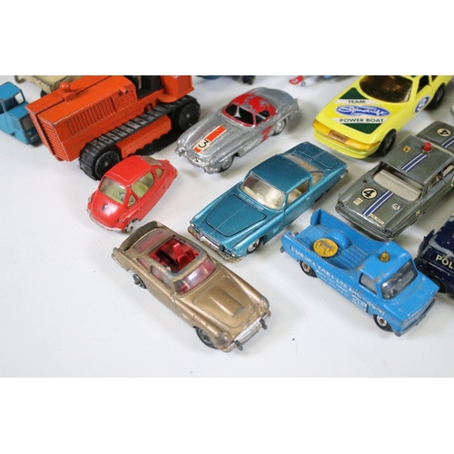 311 - Over 30 mid 20th C play worn diecast & plastic models to include Dinky, Corgi, Lonestar etc