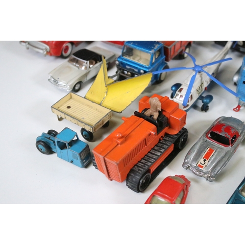 311 - Over 30 mid 20th C play worn diecast & plastic models to include Dinky, Corgi, Lonestar etc