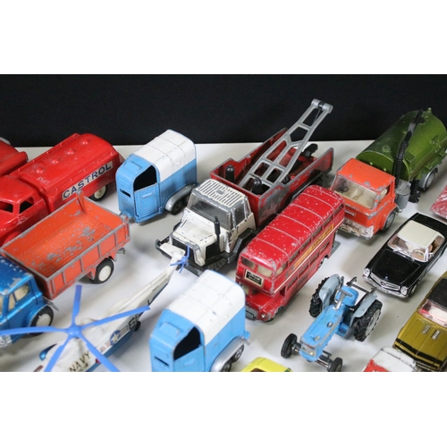 311 - Over 30 mid 20th C play worn diecast & plastic models to include Dinky, Corgi, Lonestar etc