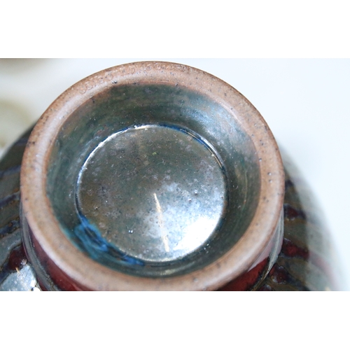 80 - Collection of studio pottery, to comprise a footed caddy with oat meal glaze and tenmoku accents, a ... 