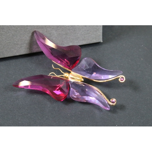 81 - Twenty-five boxed Swarovski crystal glass ornaments, to include a selection of 925 Sterling Silver g... 