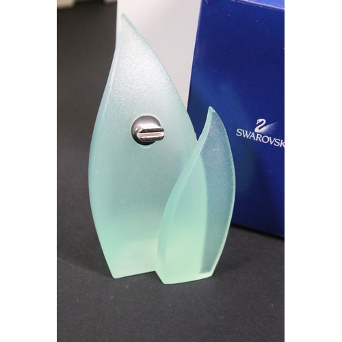 81 - Twenty-five boxed Swarovski crystal glass ornaments, to include a selection of 925 Sterling Silver g... 