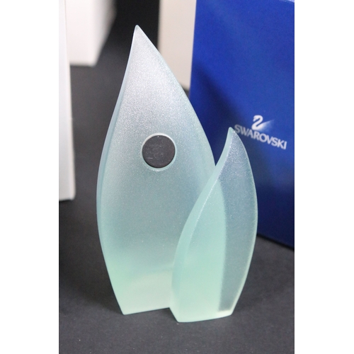81 - Twenty-five boxed Swarovski crystal glass ornaments, to include a selection of 925 Sterling Silver g... 