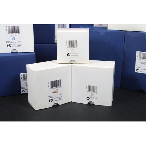 81 - Twenty-five boxed Swarovski crystal glass ornaments, to include a selection of 925 Sterling Silver g... 